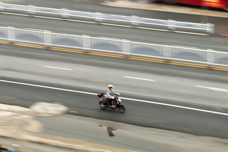 riding bike galloping on the roadの写真素材