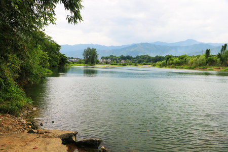 a quiet river flowing in the summerの写真素材