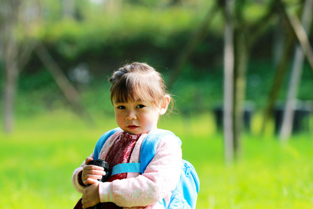 Cute little girl having fun in the park