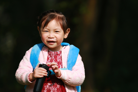 Cute little girl laughing at the cameraの写真素材