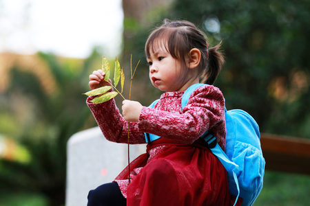 Little girl playing aloneの写真素材