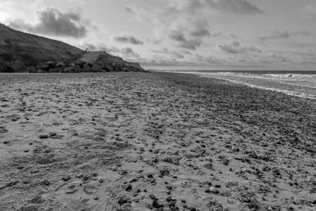 Dark clouds in the evening sky make Happisburgh beach a gloomy place.