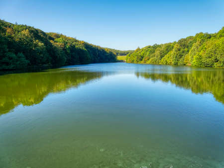 Looking down the length of Linacre Lower Reservoir in Derbyshireの写真素材