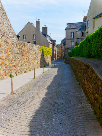 On the deserted, narrow cobbled back streets of Granville, France.のeditorial素材