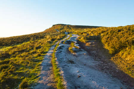 Early morning on a frosty footpath leading up to the top of Higger Tor in the Derbyshire Peak District.の写真素材