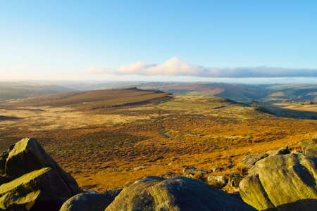 High among the rocks of Higger Tor looking across Hathersage Moor to a misty Surprise View.