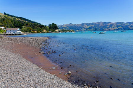 Quite summer afternoon on the beach at French Bay, Akaroa, New Zealand.の写真素材