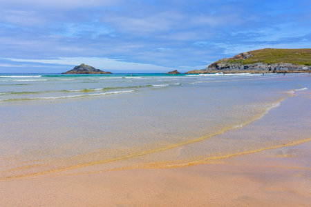 Tranquil summer morning beside the sea on Crantock beach near Newquay, Cornwall.の写真素材