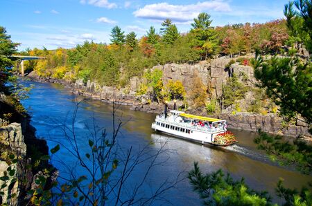passengers ride a paddleboat up the st.croix river, on the minnesota, wisconsin border.のeditorial素材