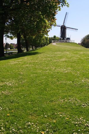 Windmill and path with a clear blue sky in Bruges, Belgium, Europeの写真素材