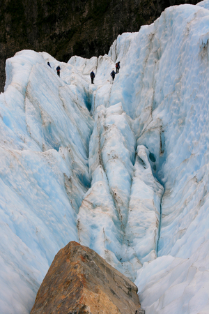 Glacier Hike across ice crevasse in Franz Joseph, New Zealandの写真素材