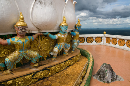 Buddha monument on mountain peak in Krabi, Thailandの写真素材