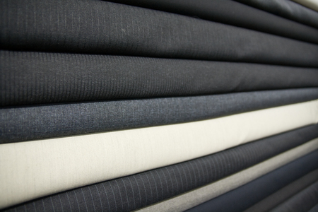 Close up of suit fabrics in tailors shopの写真素材