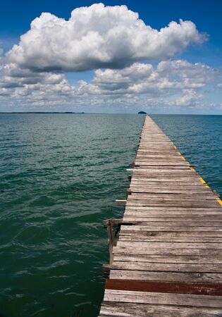 Ocean Pier with Cloudy Skyの写真素材