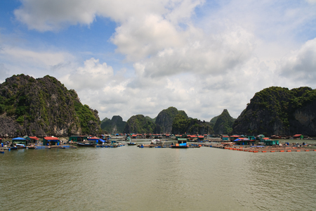 Halong Bay floating fishing village among islands, Vietnam, Asiaの写真素材