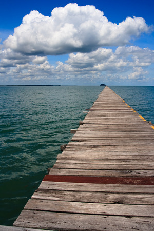 Ocean Pier with Cloudy Skyの写真素材