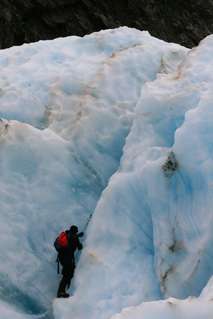 Glacier Hike across ice crevasse in Franz Joseph, New Zealandの写真素材
