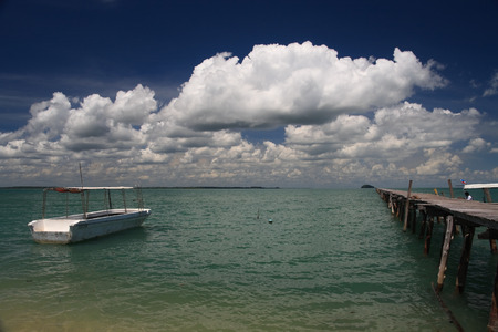 Boat floating by Ocean Pierの写真素材