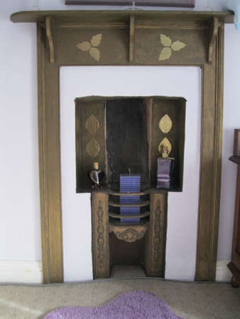 Renovated decorative fireplace in cottageの写真素材