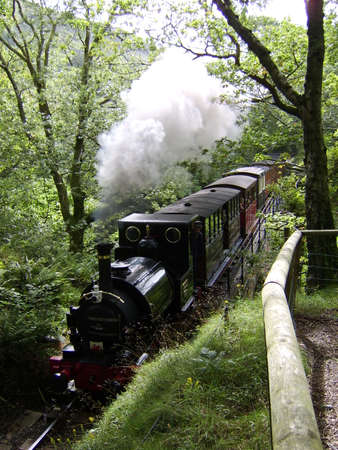 Steam train through welsh hillsideのeditorial素材