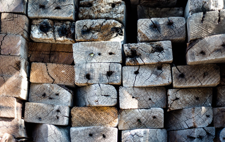 Stacked distressed 2x4 lumber viewed from endの写真素材