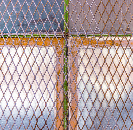 Urban cross: industrial building's old windowの写真素材