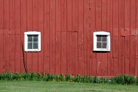 Two White Windows in Red Barnの写真素材