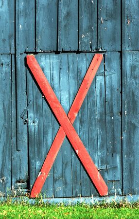 Red X on Blue Barnの写真素材