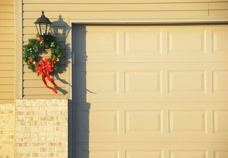 Christmas Wreath by the Garage Doorの写真素材