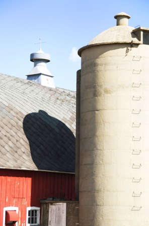 Red Barn, Silo, and Shadowの写真素材