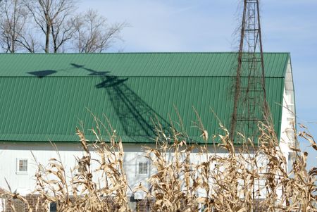 Broken Windmill Shadow on the Barnの写真素材