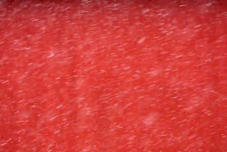 Snowfall Blur Against the Red Barnの写真素材