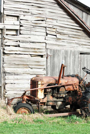 Old Tractor by Weathered Shedの写真素材