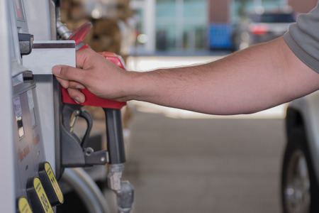 Man using credit card buying gas, at the fuel pumpの写真素材
