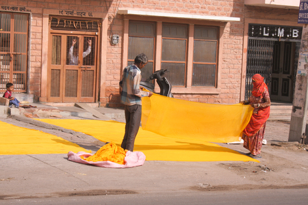 30th November 2015, Jodhpur, Rajastan, India. Traditional process of dyeing yellow cloth. Exploring the delights the Blue City of Jodhpur has to offerのeditorial素材