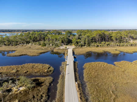 Aerial view of a road through a swamp area in the Florida Everglades.