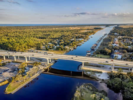 Aerial view of the bridge over the river in a small town.の写真素材