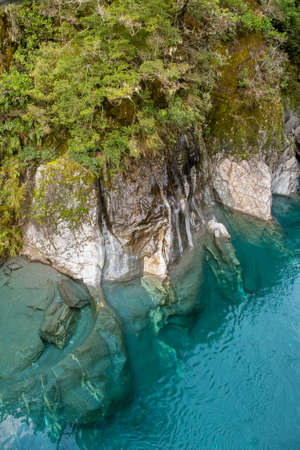 Crystal blue clear water at the river in the forestの写真素材