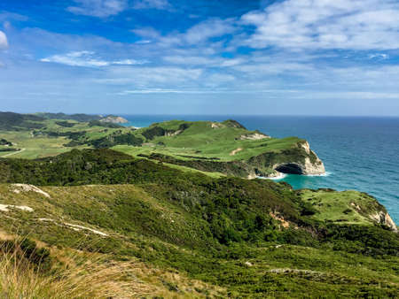 the stunning dramatic coastal scenery at Cale farewell with the agricultural fields meeting the caves and cliffs of the ocean coastlineの写真素材