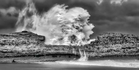 Massive cyclonic waves demonstrating the power of the ocean smashing the coastal reefの写真素材