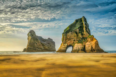 The Archway Islands are a group of rock stacks off Wharariki Beach on New Zealand's South Island near Pupongaの写真素材