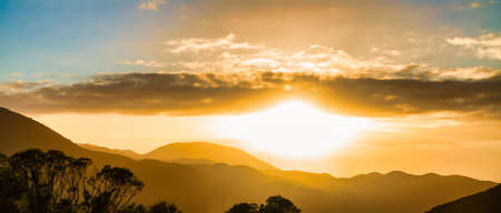 Layers of mountains and hills at dawn looking down from the top of the Rimutaka hillの写真素材