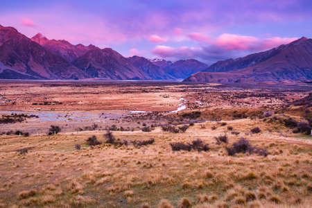 Dramatic coloured sunset  sky in the alpine glacial valleyの写真素材
