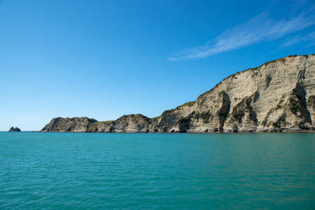 view of the promotory  off the end f the historic pier at Tolaga Bay New Zealandの写真素材