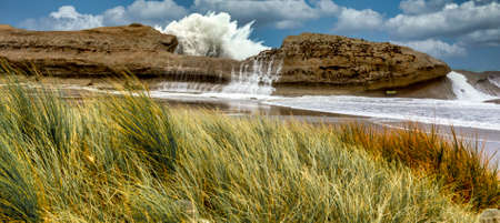 Huge swell and massive waves on a very stormy day at CastlePoint reek in Wairarapa new Zealandの写真素材