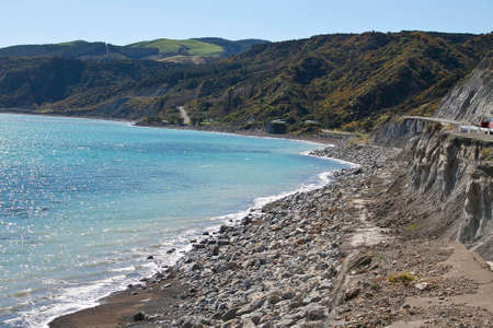 Dramatic rugged crumbling cliffs on the Cape Palliser coastlineの写真素材