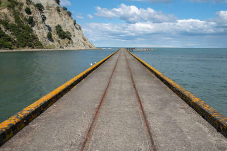 Vanishing point perspective on the Historic Tokomaru bay wharfの写真素材