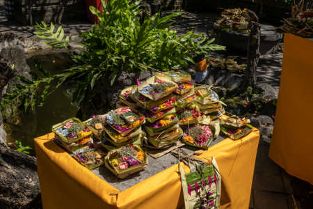 Table full of Hindu religious offerings ACat the Balinese ceremonyの写真素材