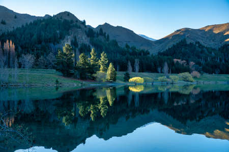 The stunning reflections and scenery in the grounds of Lake Benmore Power station inNew Zealand