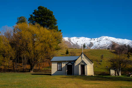 Beautiful historic church at Cardrona New Zealand under the snow capped Southern Alps